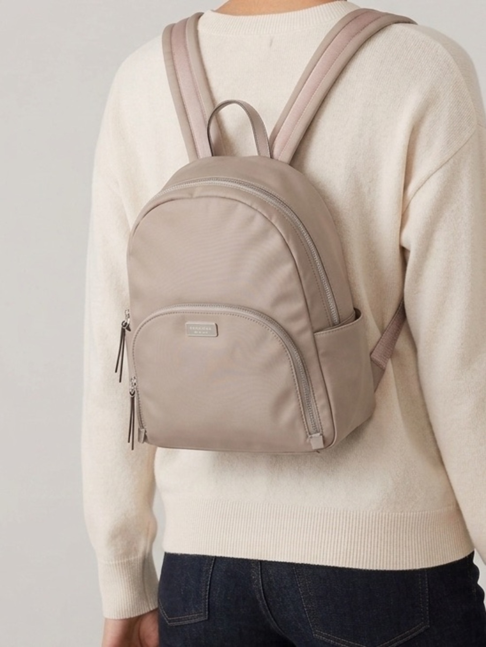 kate spade Dawn light gray nylon backpack with silver plaque